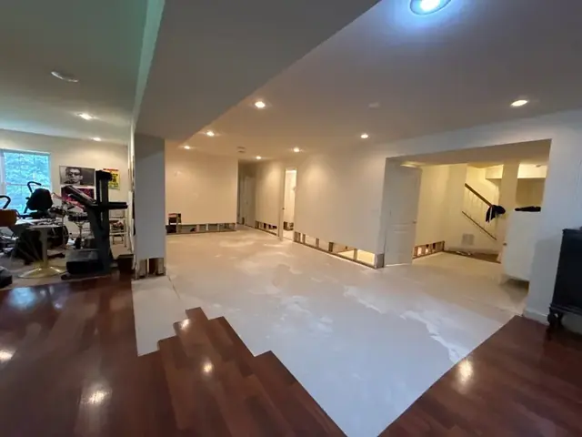 Finished basement with the wall base opened for drying in Columbia, MD
